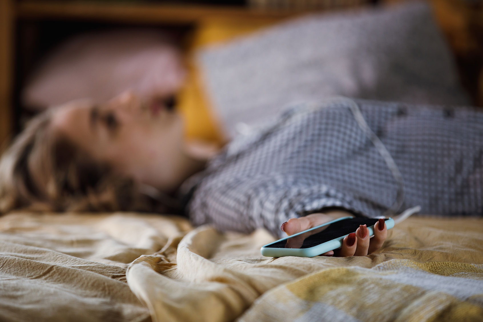 Teenage girl lying in bed (Getty Images/fotostorm)