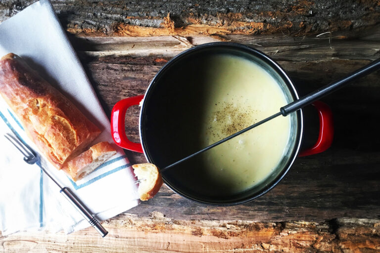 Overhead view of bread with cheese fondue (Getty Images/Cavan Images)