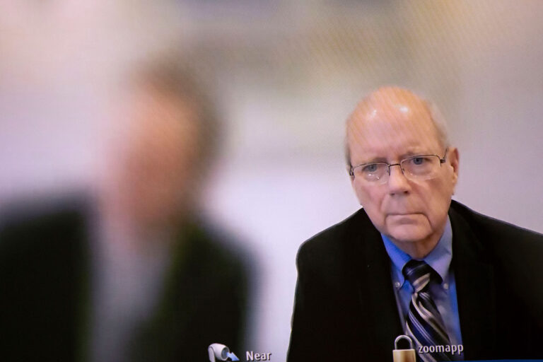 Seen on a television screen, James Renner is arraigned via Zoom in Ingham County District Court on August 10, 2023 in Lansing, Michigan. Renner is one of sixteen Republican so-called "false electors" who are being charged with eight felony counts for allegedly signing paperwork which falsely claimed that Donald Trump won Michigan's Presidential election in 2020. (Bill Pugliano/Getty Images)