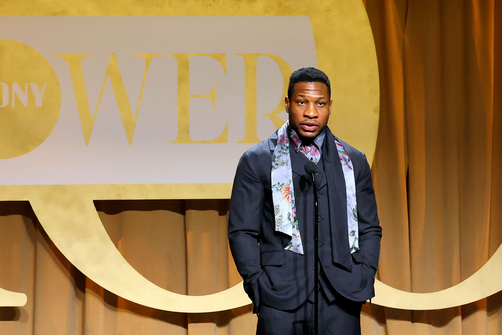 Jonathan Majors speaks onstage during EBONY Power 100 at Milk Studios Los Angeles on October 29, 2022 in Los Angeles, California. (Leon Bennett/Getty Images for EBONY MEDIA GROUP)