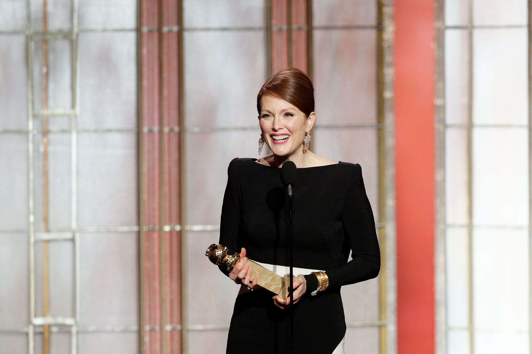 In this handout photo provided by NBCUniversal, Julianne Moore accepts the best actress award for Mini-Series or TV Movie, "Game Change" on stage during the 70th Annual Golden Globe Awards at the Beverly Hilton Hotel International Ballroom on January 13, 2013 in Beverly Hills, California. (Paul Drinkwater/NBCUniversal via Getty Images)