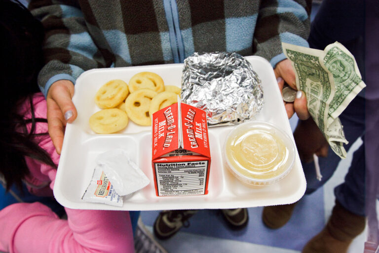 School lunch at a public elementary school in New Jersey: hamburger; milk, apple sauce and smiley faced french fries. (James Leynse/Corbis via Getty Images)