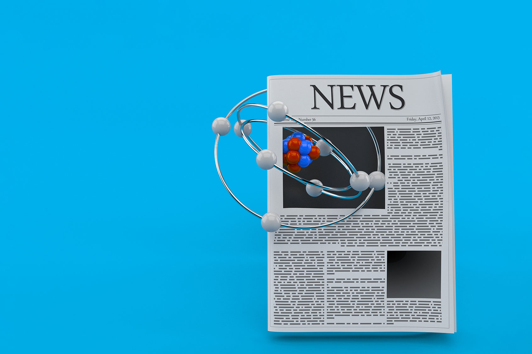 Atom model with newspaper (Getty Images/Talaj)