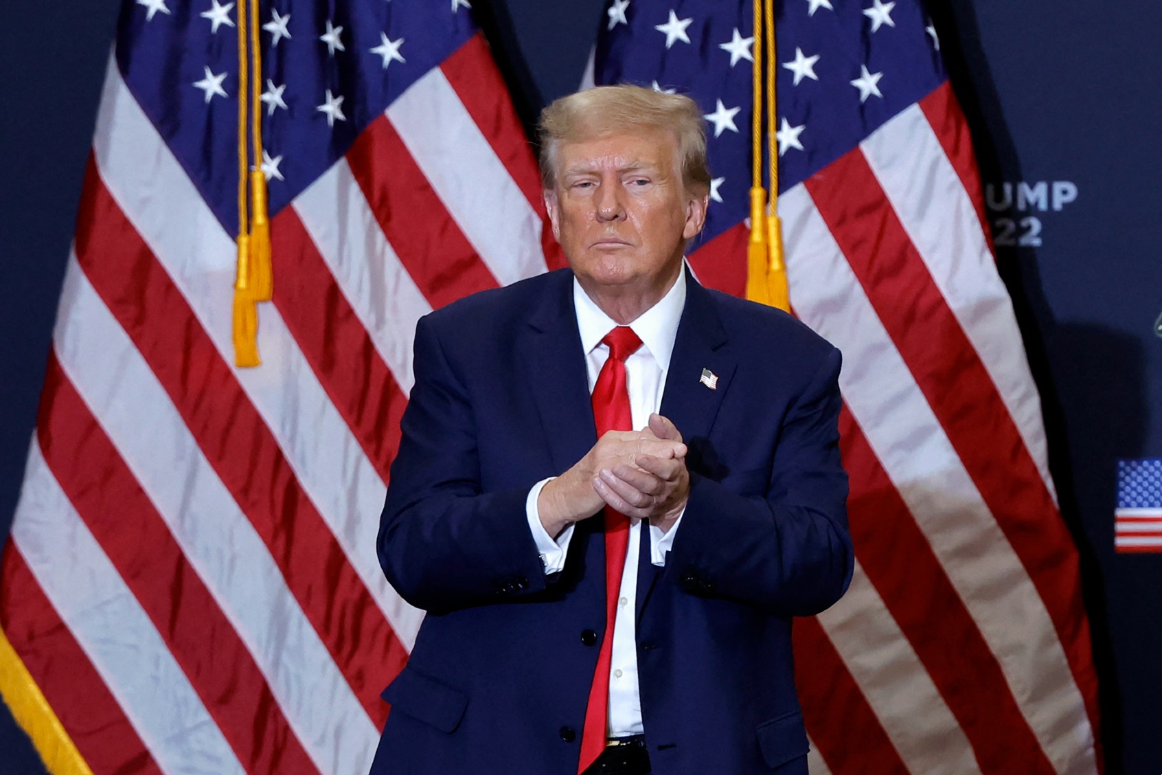 Former U.S. President and 2024 presidential hopeful Donald Trump gestures at the end of a campaign event in Waterloo, Iowa, on December 19, 2023. (KAMIL KRZACZYNSKI/AFP via Getty Images)