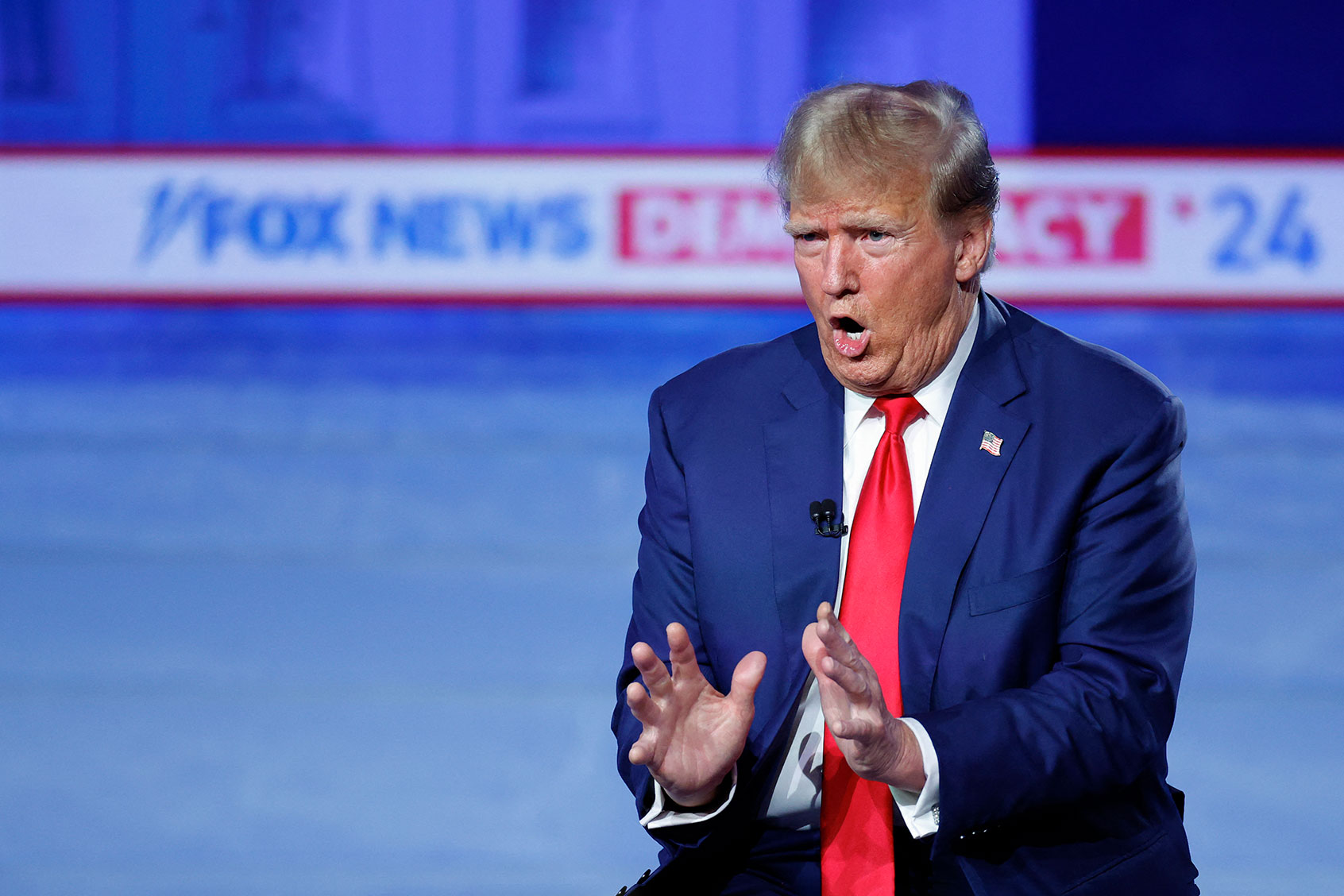Former US President and 2024 Republican presidential hopeful Donald Trump gestures as he speaks during a town hall in Des Moines, Iowa, on January 10, 2024. (KAMIL KRZACZYNSKI/AFP via Getty Images)
