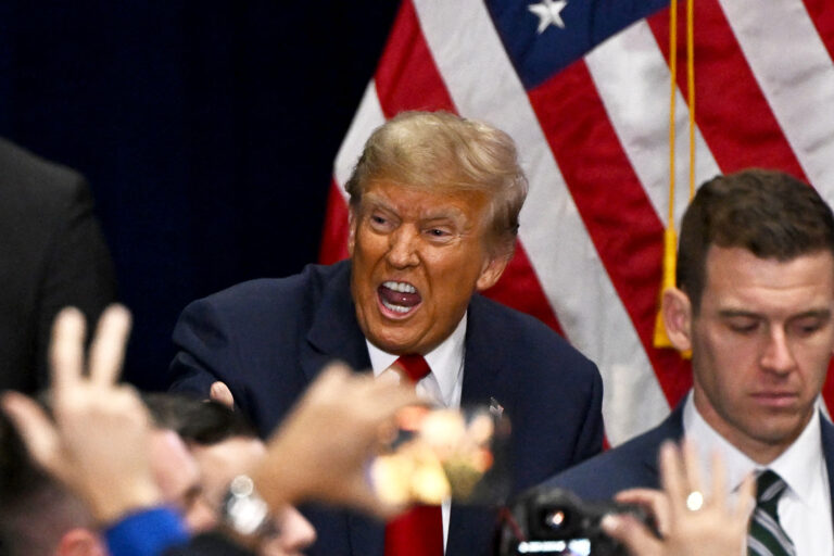Former US President and Republican presidential hopeful Donald Trump arrives to speak at a watch party during the 2024 Iowa Republican presidential caucuses in Des Moines, Iowa, on January 15, 2024. (JIM WATSON/AFP via Getty Images)