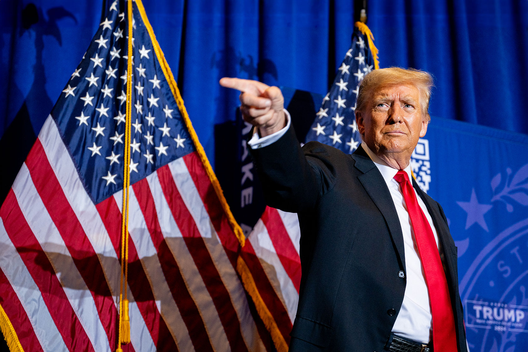 Republican presidential candidate, former U.S. President Donald Trump points to supporters at the conclusion of a campaign rally at the Atkinson Country Club on January 16, 2024 in Atkinson, New Hampshire. (Brandon Bell/Getty Images)