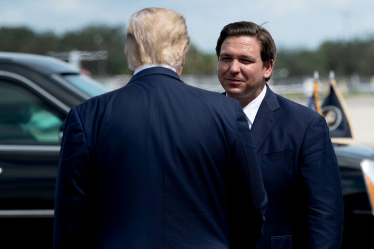 US President Donald Trump is greeted by Florida Governor Ron DeSantis at Southwest Florida International Airport October 16, 2020, in Fort Myers, Florida. (Photo by Brendan Smialowski / AFP) (Photo by (BRENDAN SMIALOWSKI/AFP via Getty Images)