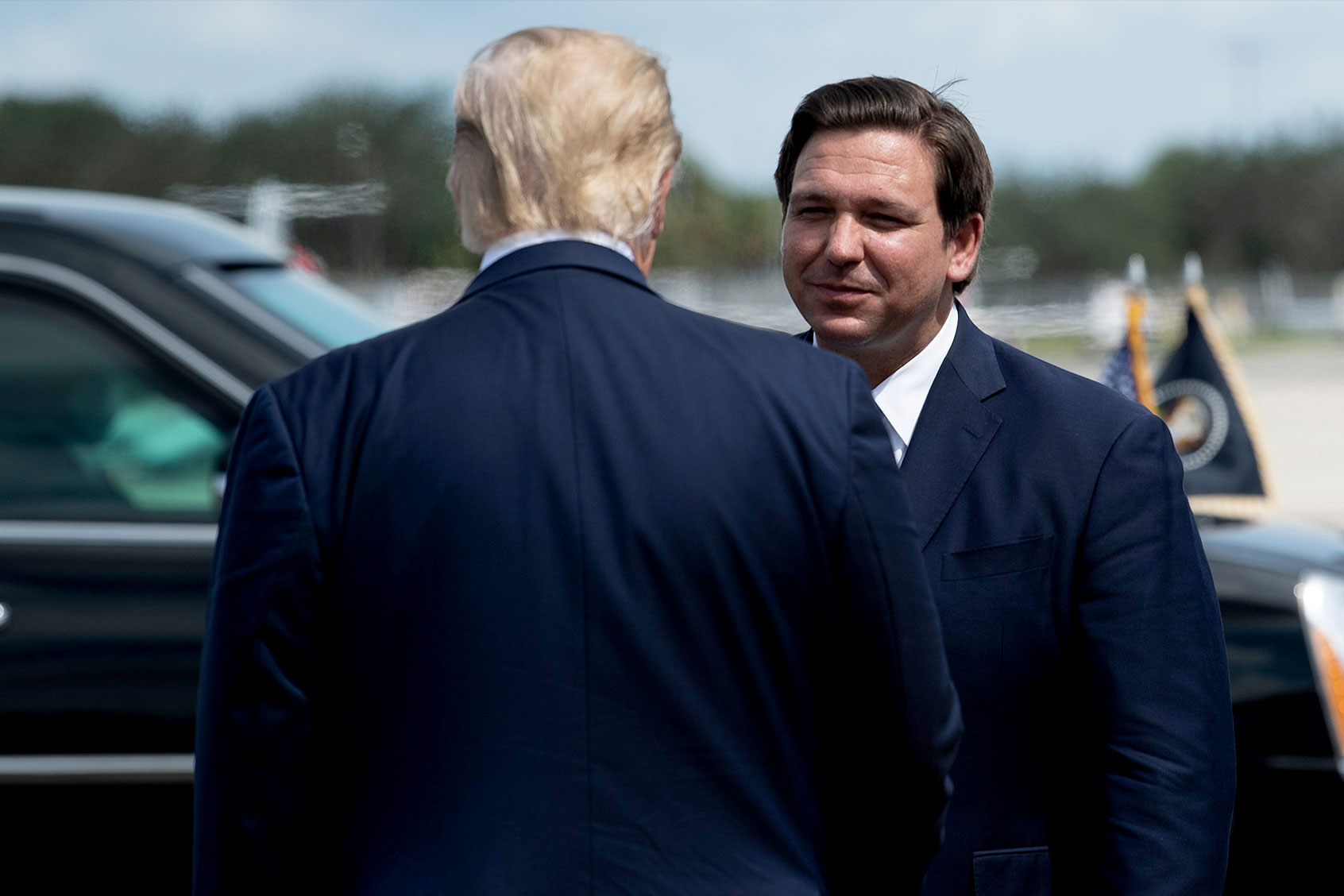 US President Donald Trump is greeted by Florida Governor Ron DeSantis at Southwest Florida International Airport October 16, 2020, in Fort Myers, Florida. (Photo by Brendan Smialowski / AFP) (Photo by (BRENDAN SMIALOWSKI/AFP via Getty Images)