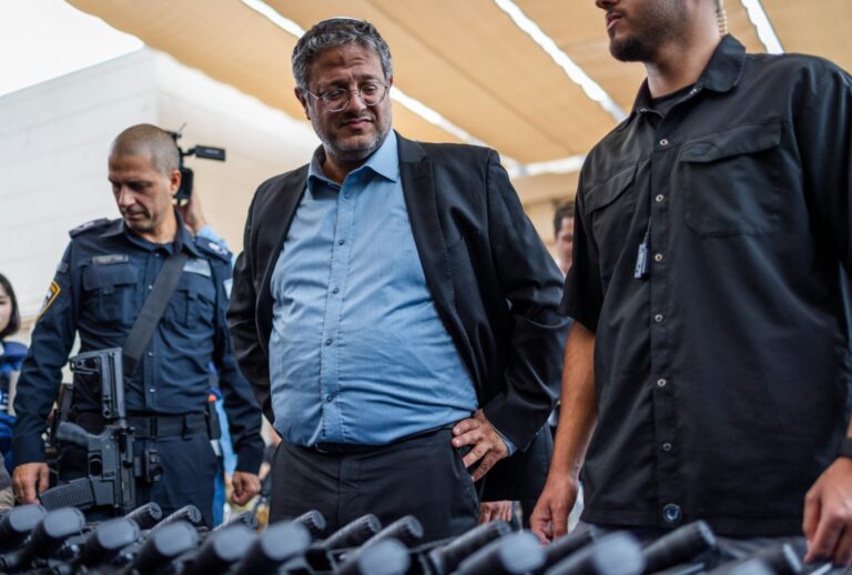 Israel's National Security Minister Itamar Ben-Gvir (C) attends an inauguration ceremony of the new civilian guard unit and hands out M5 automatic assault rifles (Ilia Yefimovich/picture alliance via Getty Images)