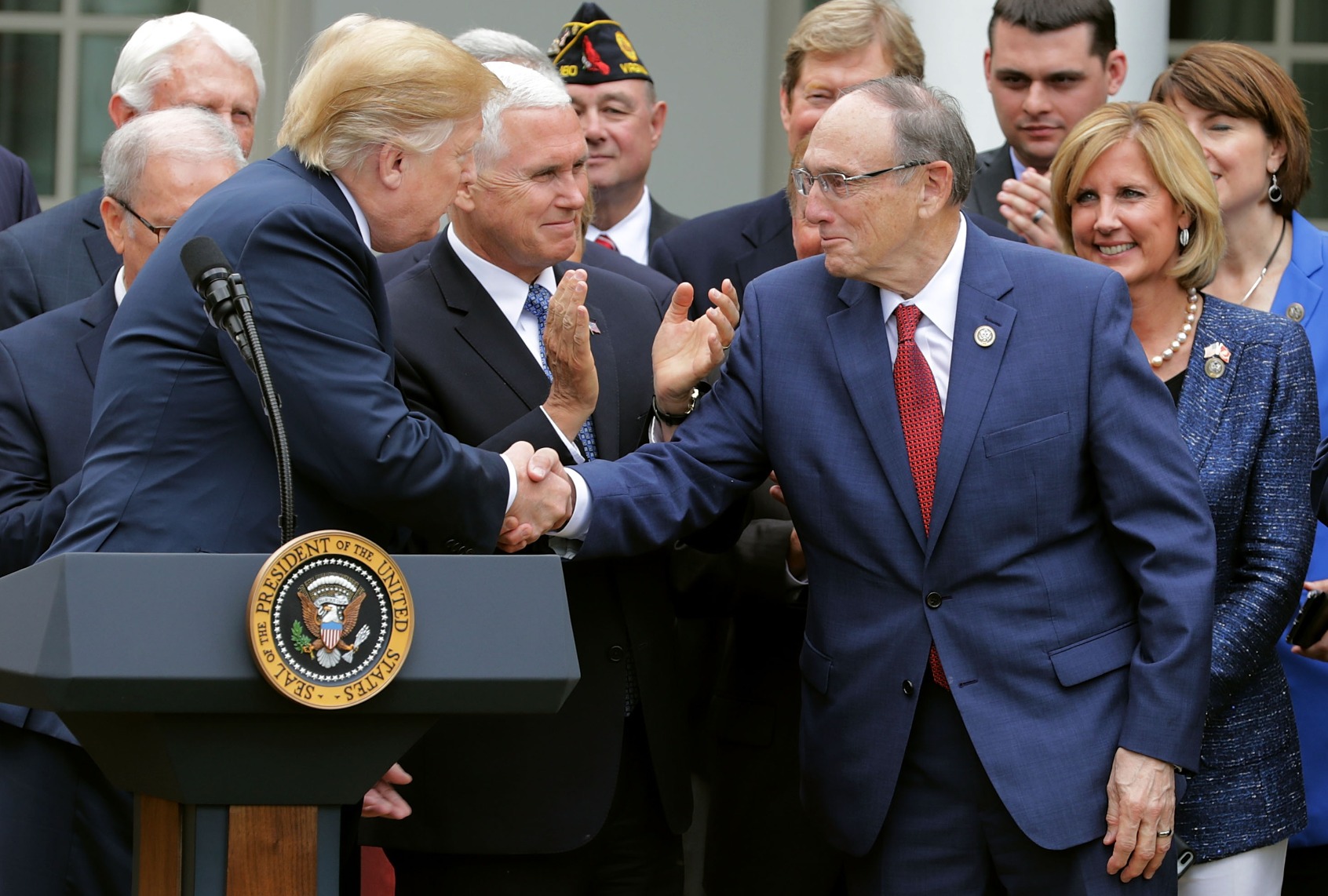 Former President Donald Trump shakes hands with former House Veterans Affairs Committee Chairman Phil Roe (R-TN) during the signing ceremony for the Veterans Affairs Mission Act at the White House on June 6, 2018 in Washington, DC. (Chip Somodevilla/Getty Images)