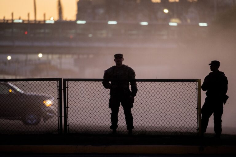 National Guard soldiers stand guard on the banks of the Rio Grande river at Shelby Park on January 12, 2024 in Eagle Pass, Texas. The Texas National Guard continues its blockade and surveillance of Shelby Park in an effort to deter illegal immigration. The Department of Justice has accused the Texas National Guard of blocking Border Patrol agents from carrying out their duties along the river. (Brandon Bell/Getty Images)