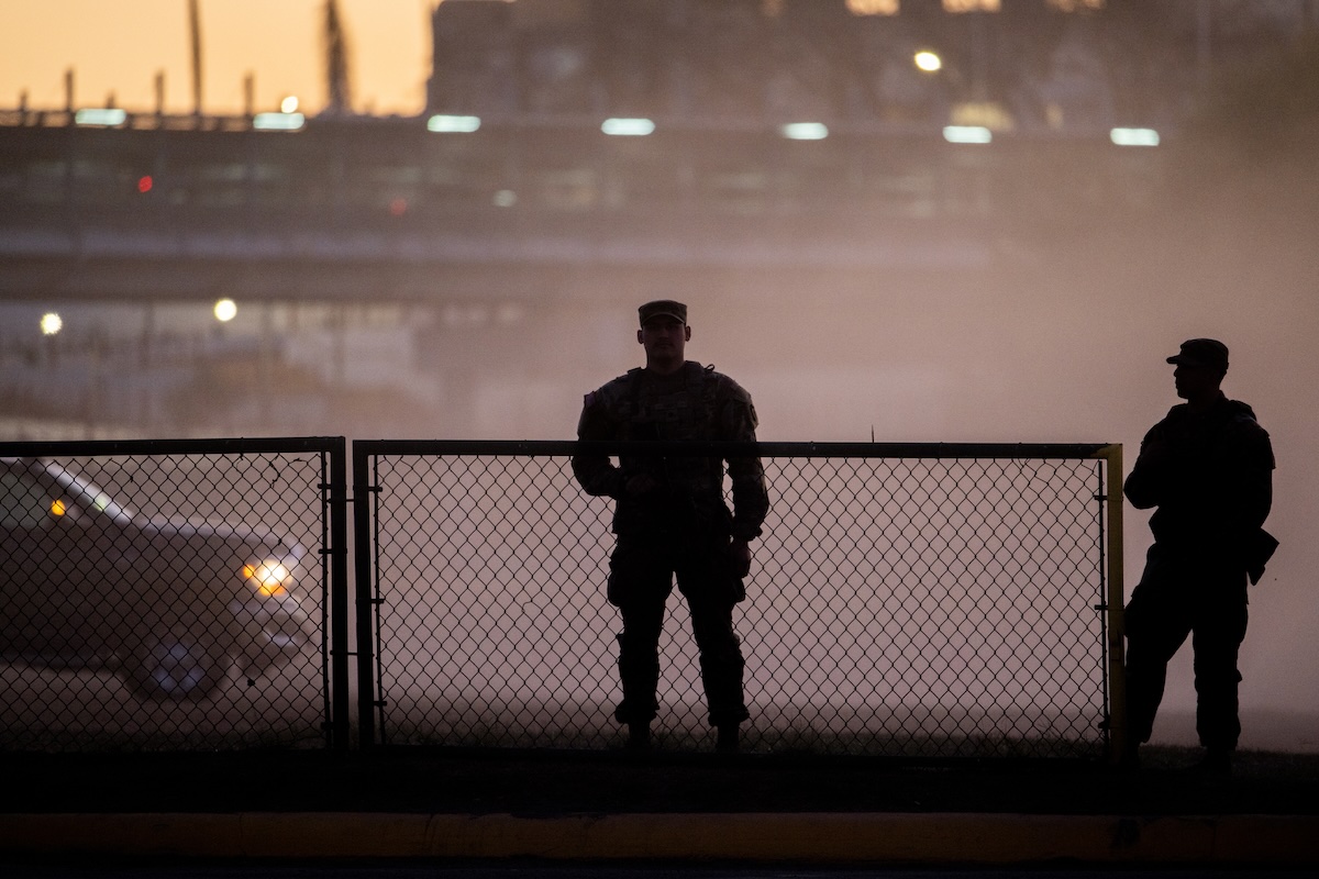 National Guard soldiers stand guard on the banks of the Rio Grande river at Shelby Park on January 12, 2024 in Eagle Pass, Texas. The Texas National Guard continues its blockade and surveillance of Shelby Park in an effort to deter illegal immigration. The Department of Justice has accused the Texas National Guard of blocking Border Patrol agents from carrying out their duties along the river. (Brandon Bell/Getty Images)