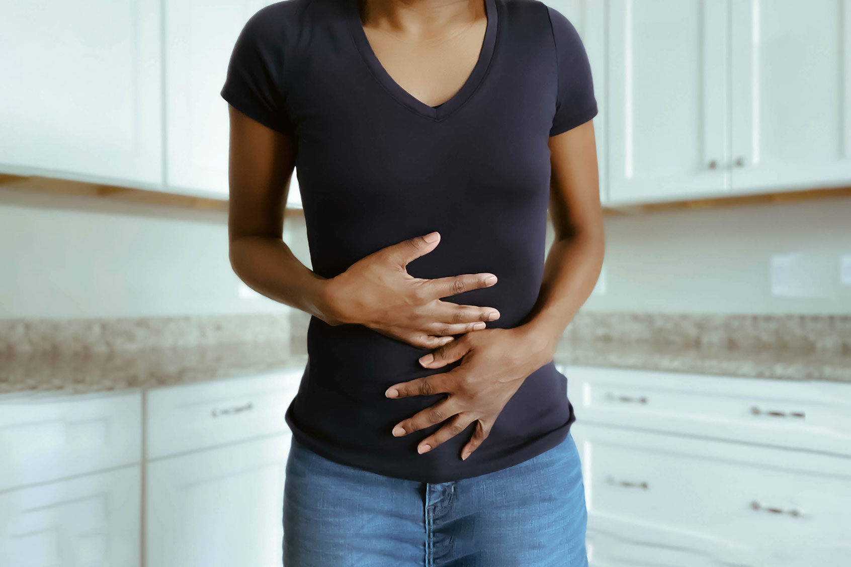 Woman Suffers Stomach Pains (Getty Images/Grace Cary)