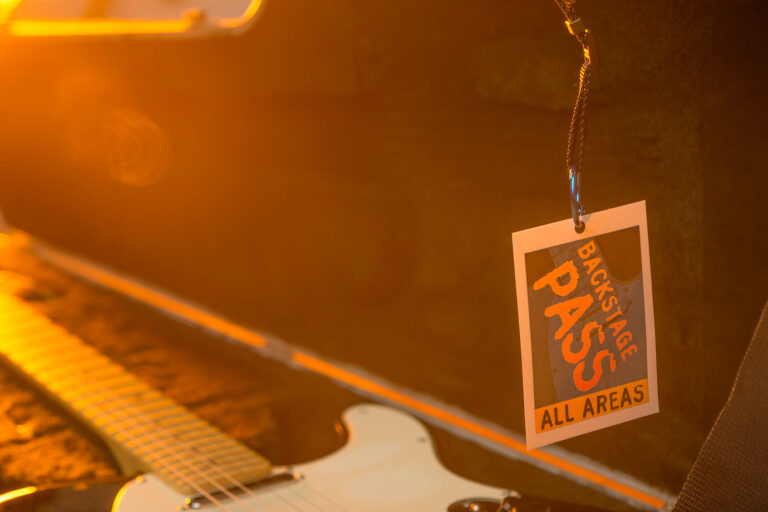 Backstage pass with guitar (Getty Images/courtneyk)