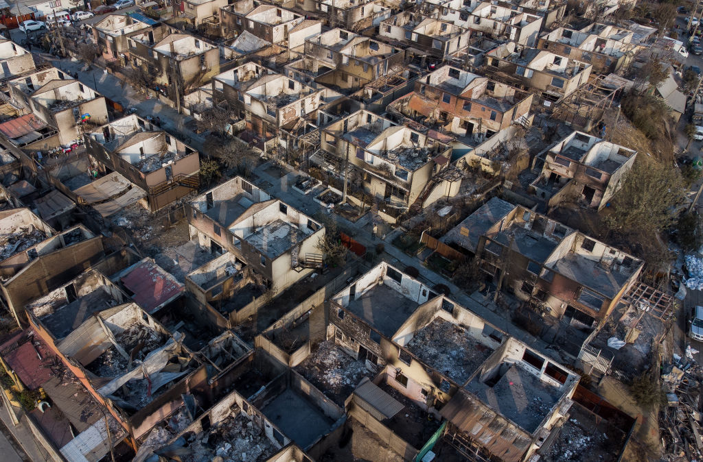 View of destroyed houses at Villa El Olivar after the forest fires on February 4, 2024 in Vina del Mar, Chile. (Claudio Santana/Getty Images)