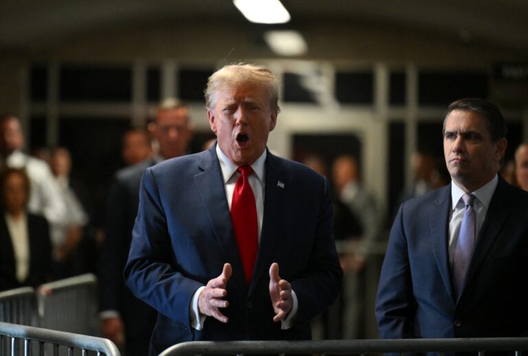 Former President Donald Trump speaks to the press as he arrives at Manhattan Criminal Court for a hearing in his case of paying hush money to cover up extramarital affairs in New York City on February 15, 2024. (ANGELA WEISS/AFP via Getty Images)