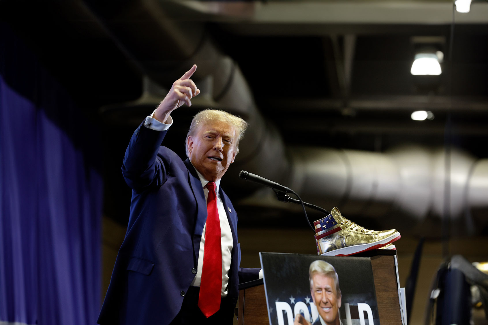 Republican presidential candidate and former President Donald Trump takes the stage to introduce a new line of signature shoes at Sneaker Con at the Philadelphia Convention Center on February 17, 2024 in Philadelphia, Pennsylvania. (Chip Somodevilla/Getty Images)
