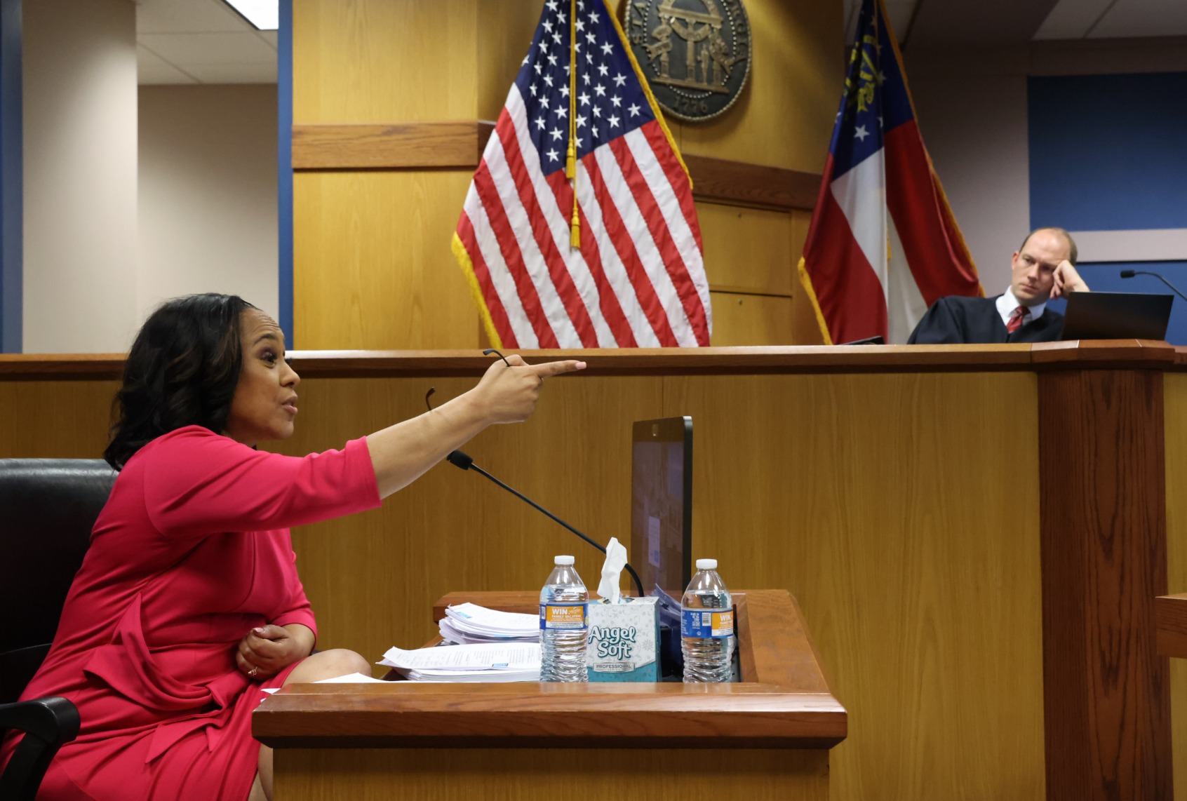 District Attorney Fani Willis speaks from a witness stand in front of Fulton County Superior Judge Scott McAfee during a hearing in the case of State of Georgia v. Donald John Trump at the Fulton County Courthouse on February 15, 2024 in Atlanta, Georgia. ( Alyssa Pointer-Pool/Getty Images)