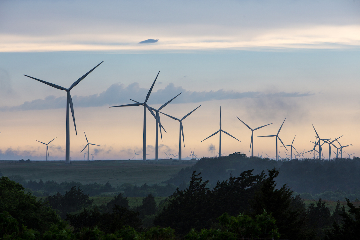 Wind turbines at sunset in Oklahoma. (Ryan McGinnis / Getty Images)