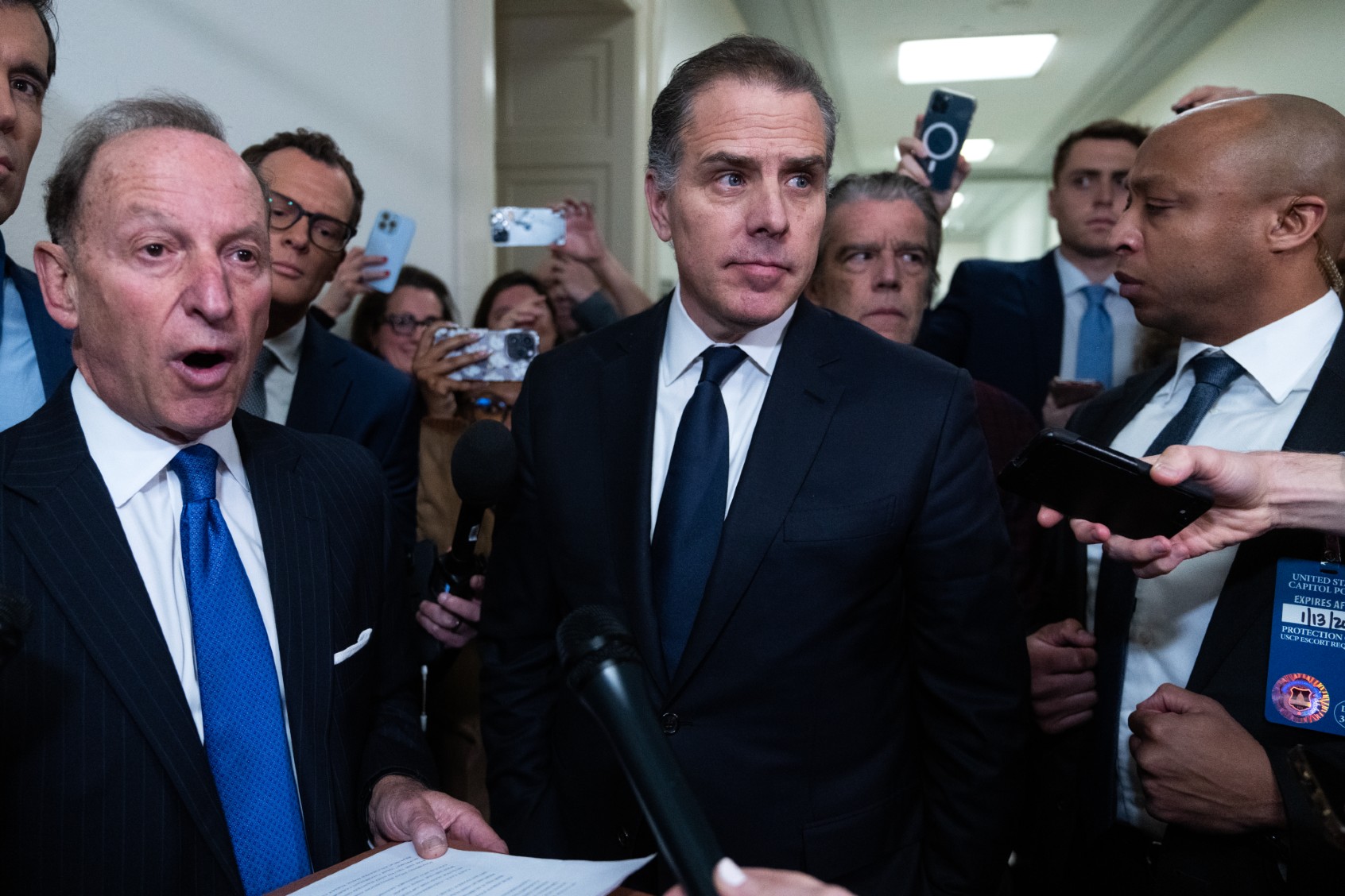 Hunter Biden, center, and his attorney Abbe Lowell, left, address the media after leaving the House Oversight and Accountability Committee markup titled "Resolution Recommending That The House Of Representatives Find Robert Hunter Biden In Contempt Of Congress," in Rayburn Building on Wednesday, January 10, 2024. (Tom Williams/CQ-Roll Call, Inc via Getty Images)