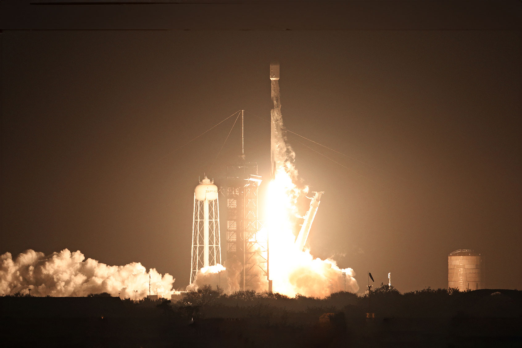 A SpaceX Falcon 9 rocket lifts off from launch pad LC-39A at the Kennedy Space Center with the Intuitive Machines' Nova-C moon lander mission, in Cape Canaveral, Florida, on February 15, 2024. (GREGG NEWTON/AFP via Getty Images)