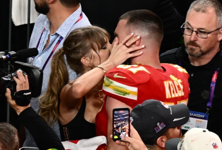 Taylor Swift kisses Kansas City Chiefs' tight end #87 Travis Kelce after the Chiefs won Super Bowl LVIII against the San Francisco 49ers at Allegiant Stadium in Las Vegas, Nevada, February 11, 2024 (PATRICK T. FALLON/AFP via Getty Images)