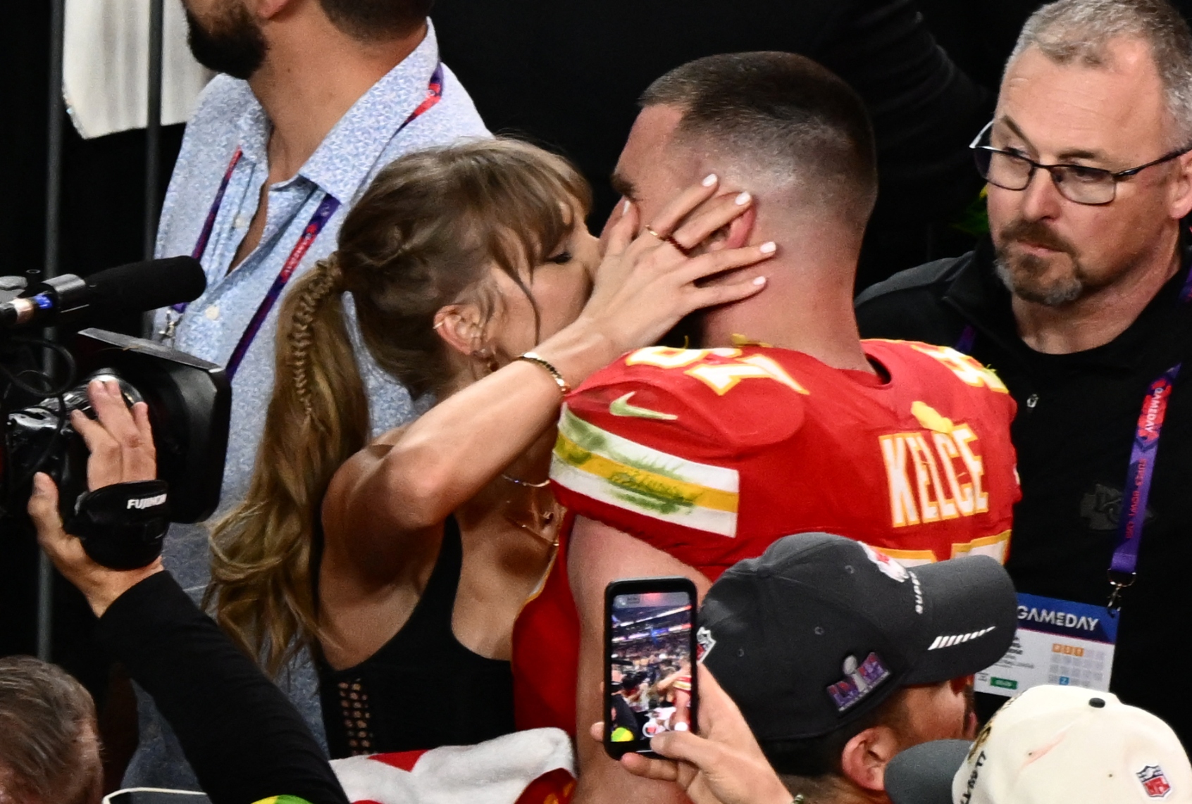 Taylor Swift kisses Kansas City Chiefs' tight end #87 Travis Kelce after the Chiefs won Super Bowl LVIII against the San Francisco 49ers at Allegiant Stadium in Las Vegas, Nevada, February 11, 2024 (PATRICK T. FALLON/AFP via Getty Images)