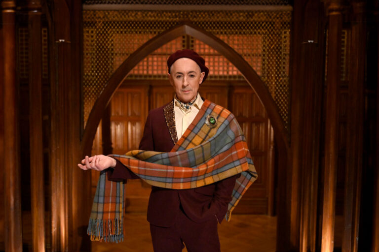 Alan Cumming on "The Traitors" (Euan Cherry/PEACOCK)