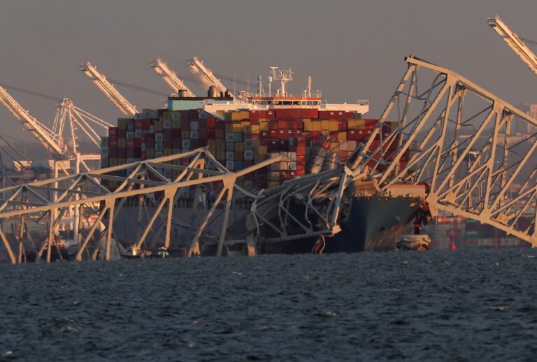 A cargo ship is shown after running into and collapsing the Francis Scott Key Bridge on March 26, 2024 in Baltimore, Maryland. Rescuers are searching for at least seven people, authorities say, while two others have been pulled from the Patapsco River. (Rob Carr/Getty Images)