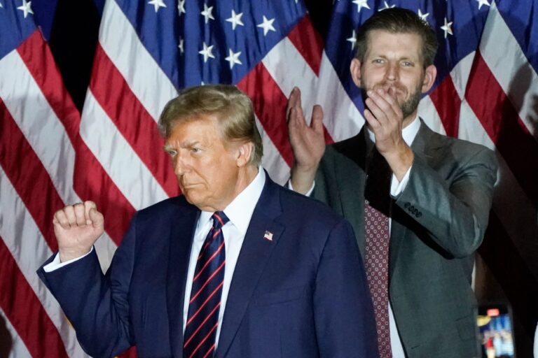 Republican presidential hopeful and former US President Donald Trump gestures next to son Eric Trump during an Election Night Party in Nashua, New Hampshire, on January 23, 2024. (TIMOTHY A. CLARY/AFP via Getty Images)