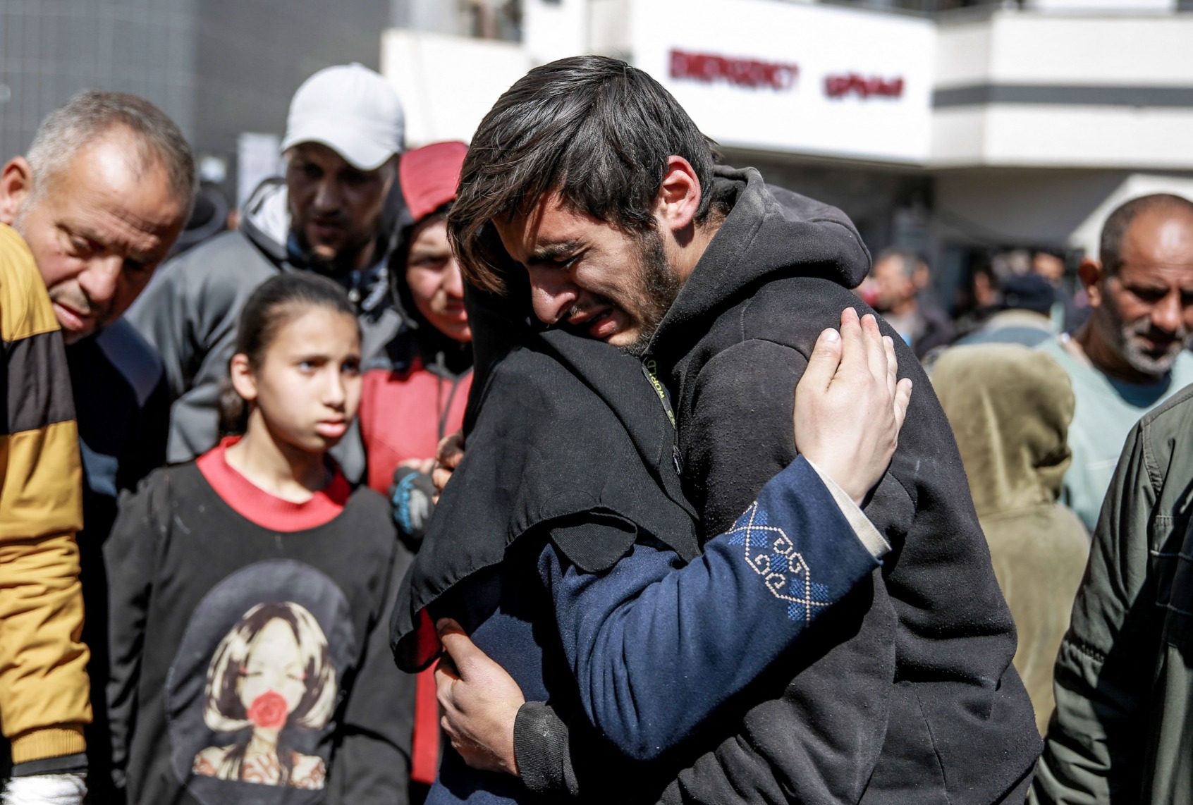 People mourn following an early morning incident when residents rushed toward aid trucks in Gaza City on February 29, 2024. (AFP via Getty Images)