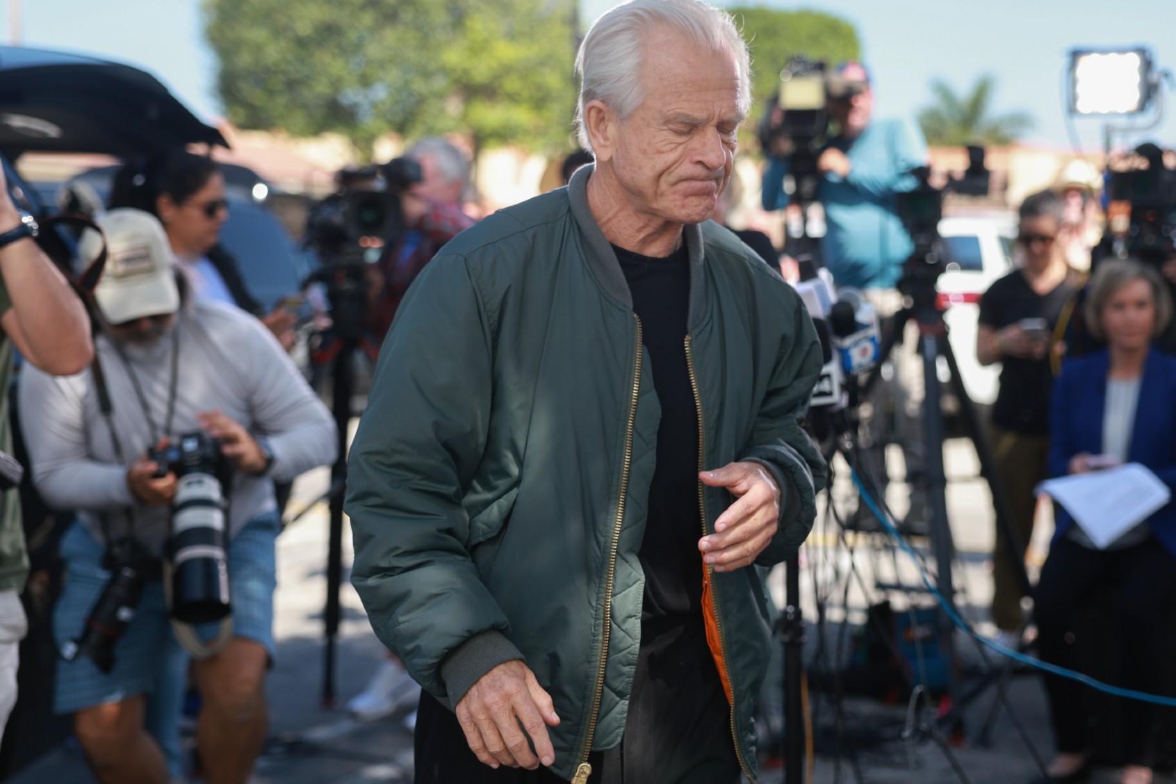 Former Donald Trump adviser Peter Navarro walks away after holding a press conference before turning himself in to a federal prison on March 19, 2024, in Miami, Florida. (Joe Raedle/Getty Images)