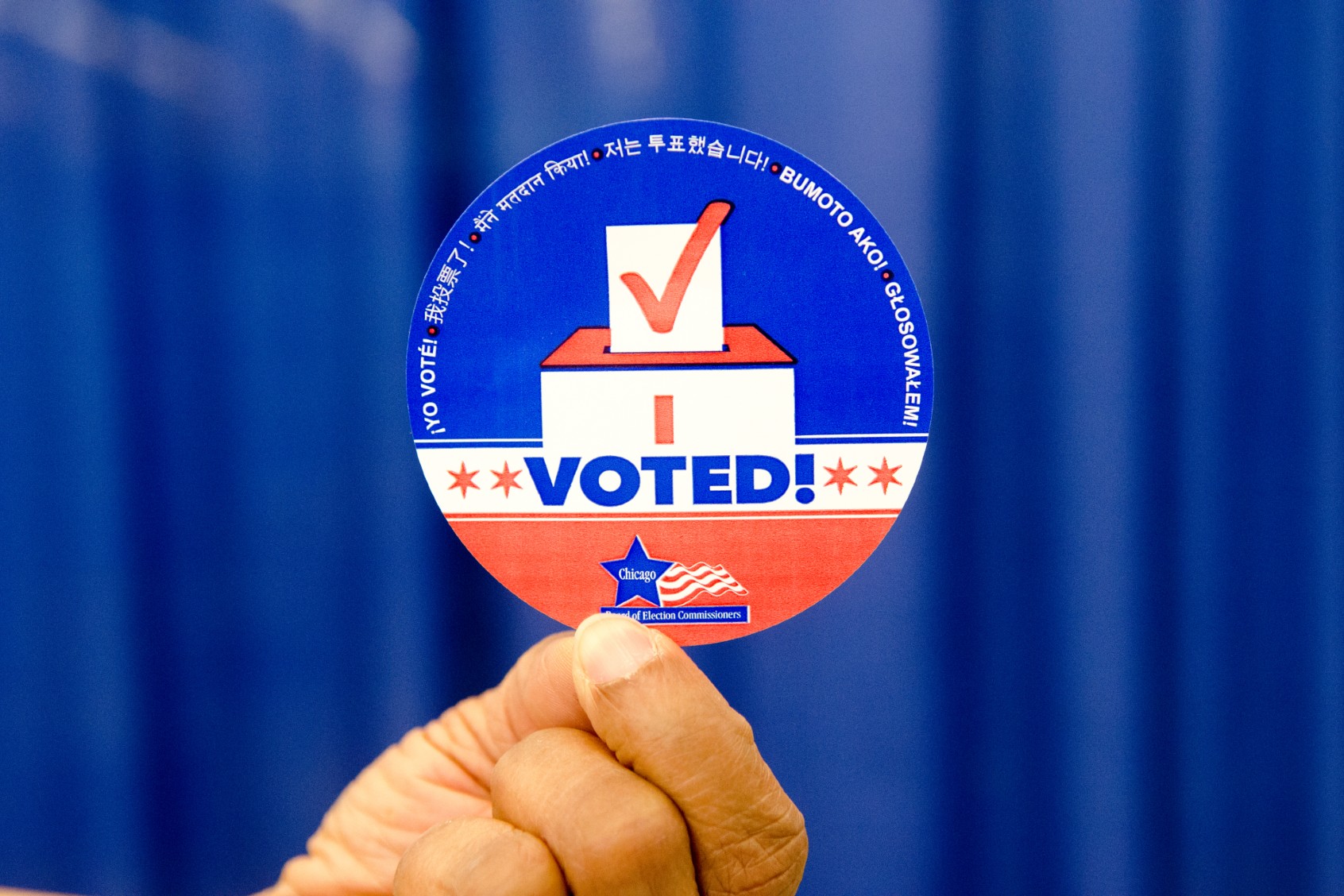 A voter shows ''I voted'' sticker at a polling station (Jacek Boczarski/Anadolu via Getty Images)