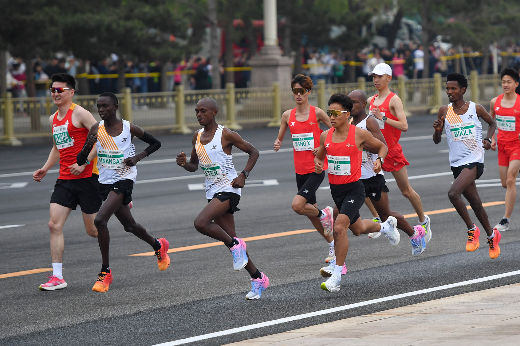 He Jie 1st L of China competes during the Bejing Half Marathon 2024 in Beijing, capital of China, April 14, 2024. (Ju Huanzong/Xinhua via Getty Images)