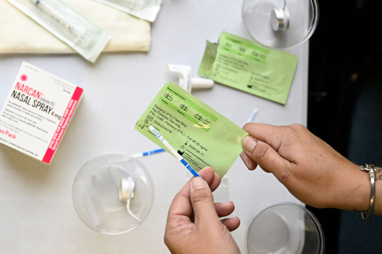 Carrie Hankins, of Jefferson County Public Health, holds a Fentanyl test strip during an event held at Lakewood Library on August 25, 2022 in Lakewood, Colorado. (RJ Sangosti/MediaNews Group/The Denver Post via Getty Images)