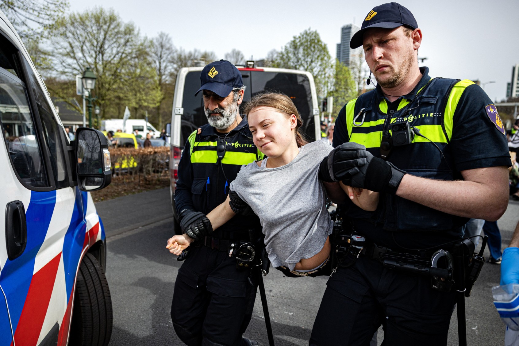 Police detain Swedish climate activist Greta Thunberg (C) during a climate march against fossil subsidies near the highway A12 in the Hague, on April 6, 2024. (RAMON VAN FLYMEN/ANP/AFP via Getty Images)