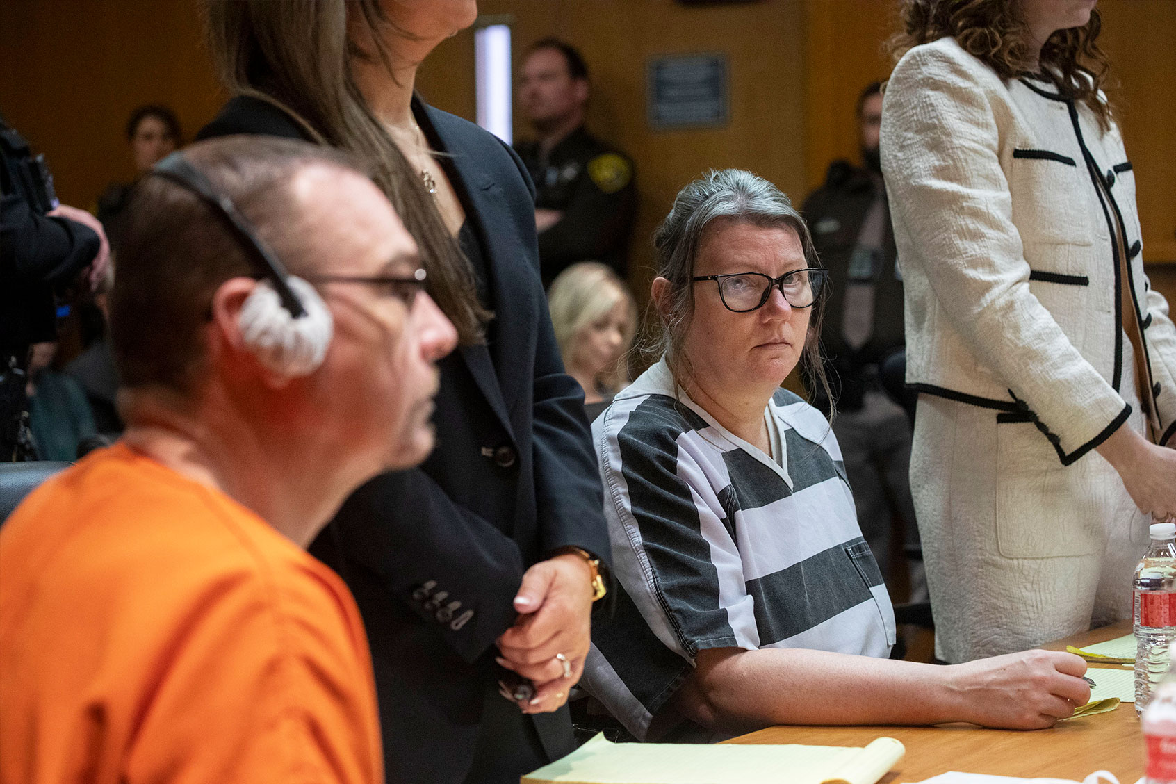 James Crumbley, his attorney Mariell Lehman, Jennifer Crumbley, and her attorney Shannon Smith, sit in court for sentencing on four counts of involuntary manslaughter for the deaths of four Oxford High School students who were shot and killed by the Crumbley parents' son, on April 9, 2024 at Oakland County Circuit Court in Pontiac, Michigan. (Bill Pugliano/Getty Images)