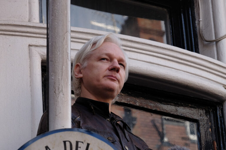 Julian Assange speaks to the media from the balcony of the Embassy Of Ecuador on May 19, 2017 in London, England. (Jay Shaw Baker/NurPhoto via Getty Images)