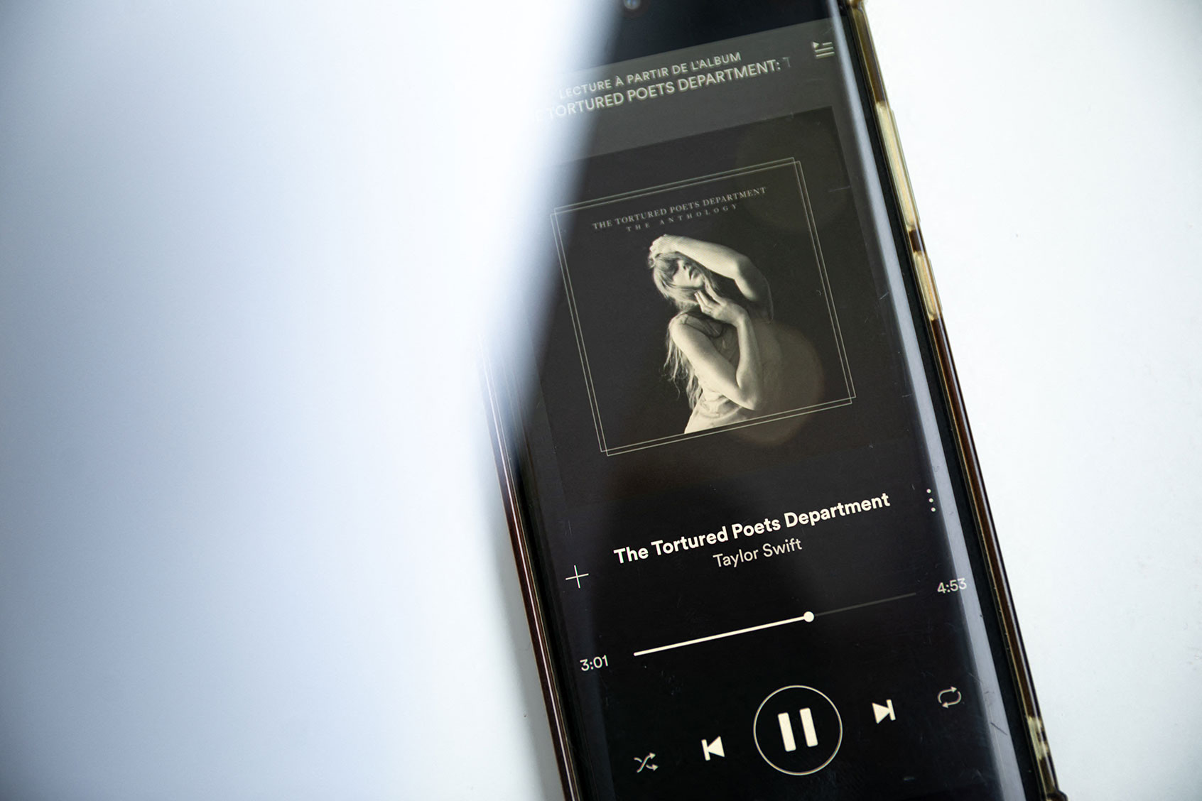 A smartphone displaying the US singer-songwriter Taylor Swift's new album "The Tortured Poets Department" on Spotify. (AFP via Getty Images)