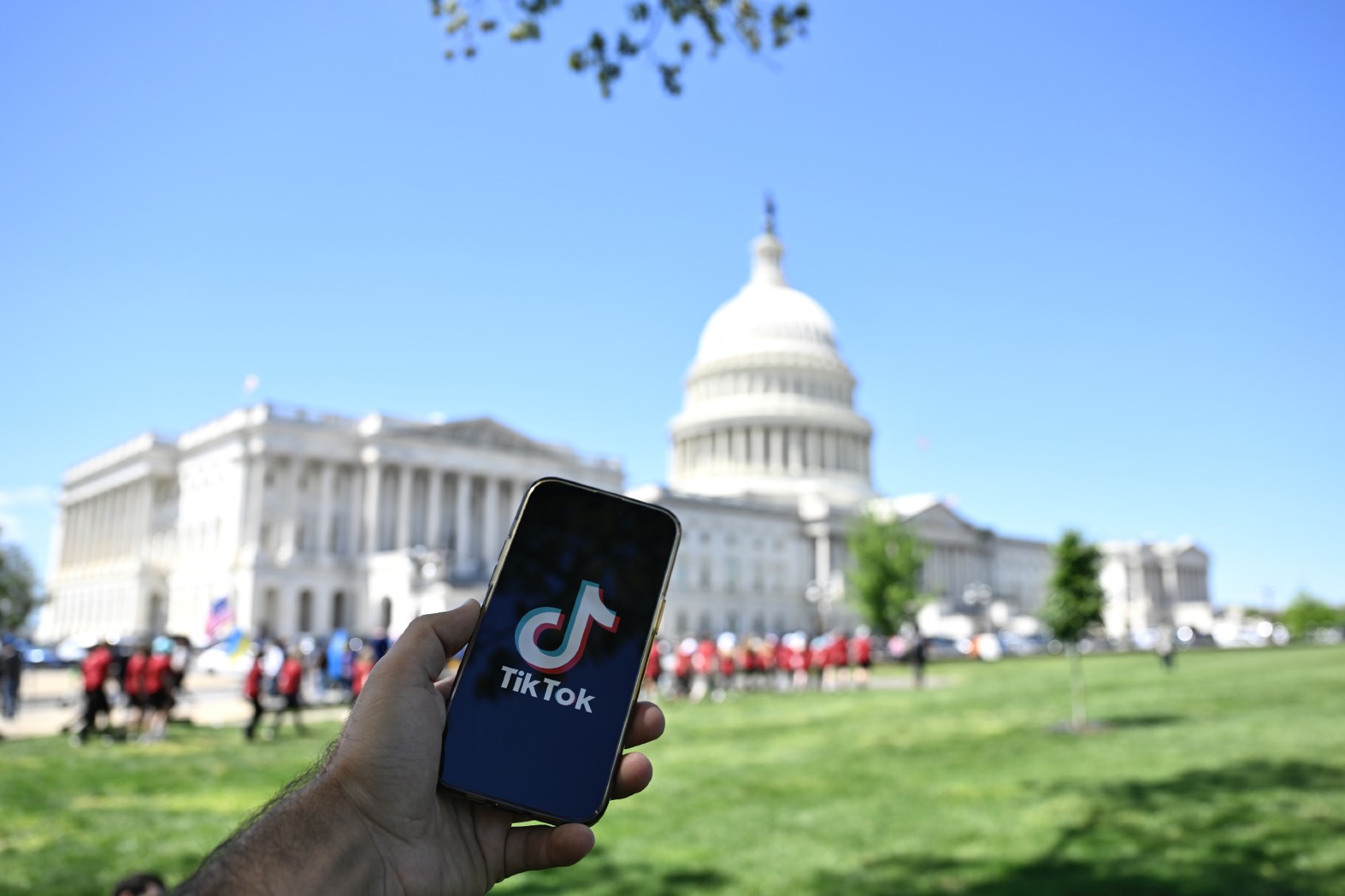 TikTok is displayed on a mobile phone screen in front of The White House in Washington DC, United States on April 20, 2024. (Celal Gunes/Anadolu via Getty Images)
