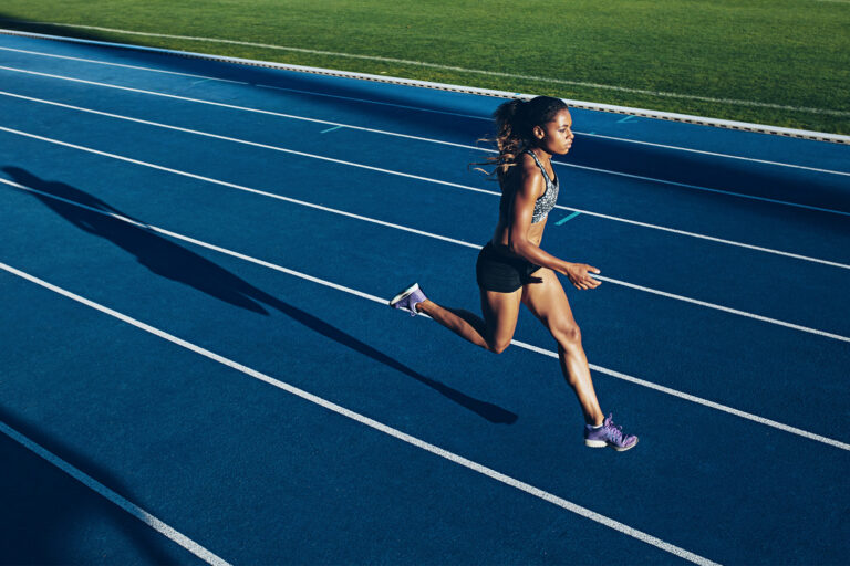 A woman running on a track (istock / Getty Images)