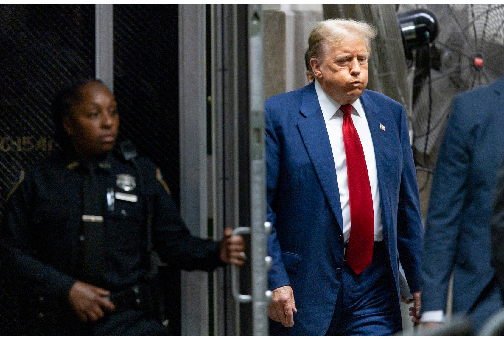 Former US President Donald Trump walks back to the courtroom after a break in his trial for allegedly covering up hush money payments linked to extramarital affairs, at Manhattan Criminal Court in New York City, on April 30, 2024. (JUSTIN LANE/POOL/AFP via Getty Images)