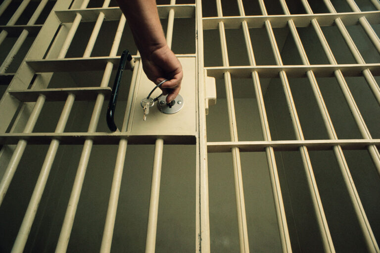 Unlocking Jail Cell Door (Getty Images/Charles O'Rear)