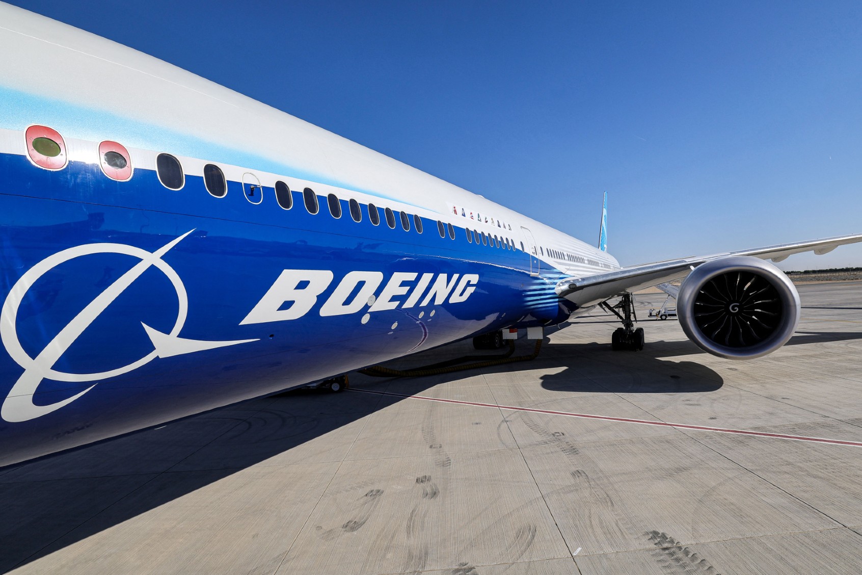 This picture taken on November 13, 2023 shows a view of the fuselage and one of the engines of a Boeing 777-9 jetliner aircraft on the tarmac during the 2023 Dubai Airshow at Dubai World Central - Al-Maktoum International Airport in Dubai. (GIUSEPPE CACACE/AFP via Getty Images)