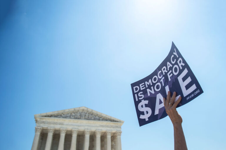 People gather outside of the Supreme Court to hear Senate Democrats unveil a constitutional amendment to overturn Citizens United in Washington on Tuesday July 30, 2019. (Caroline Brehman/CQ Roll Call/Getty Images)