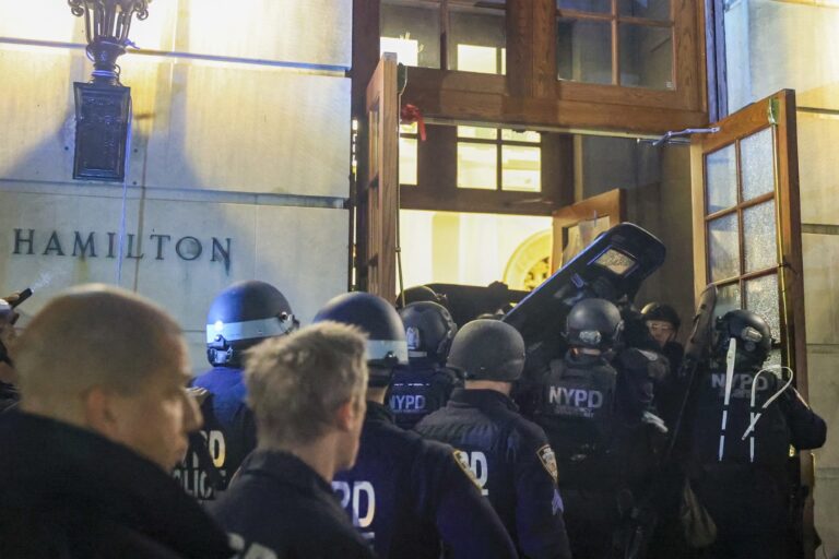 New York Police Department officers detain dozens of pro-Palestinian students at Columbia University after they barricaded themselves at the Hamilton Hall building near Gaza Solidarity Encampment earlier in New York, United States on April 30, 2024. (Selcuk Acar/Anadolu via Getty Images)