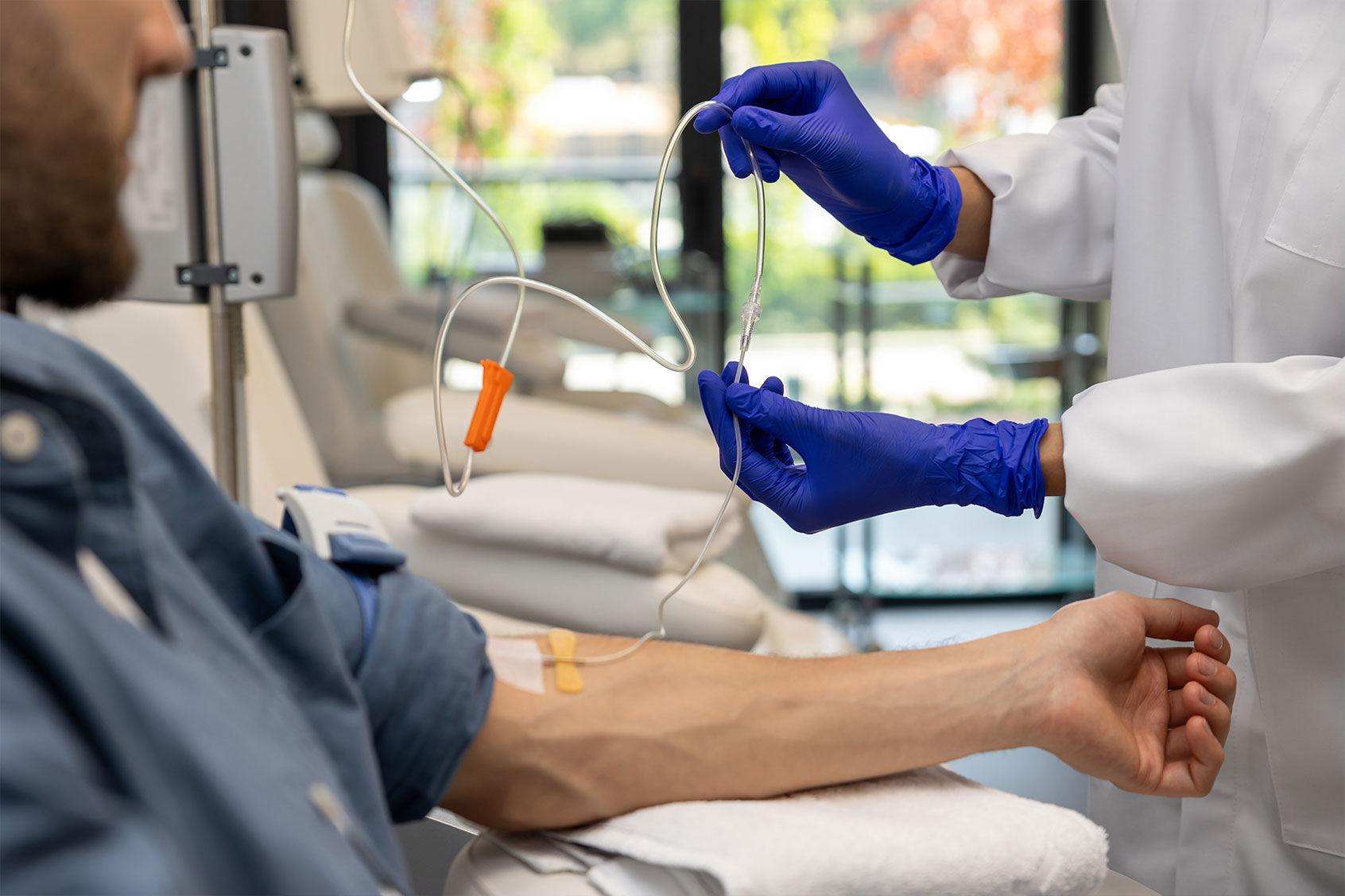 Patient man receiving IV drip in hospital (Getty Images/Zinkevych)