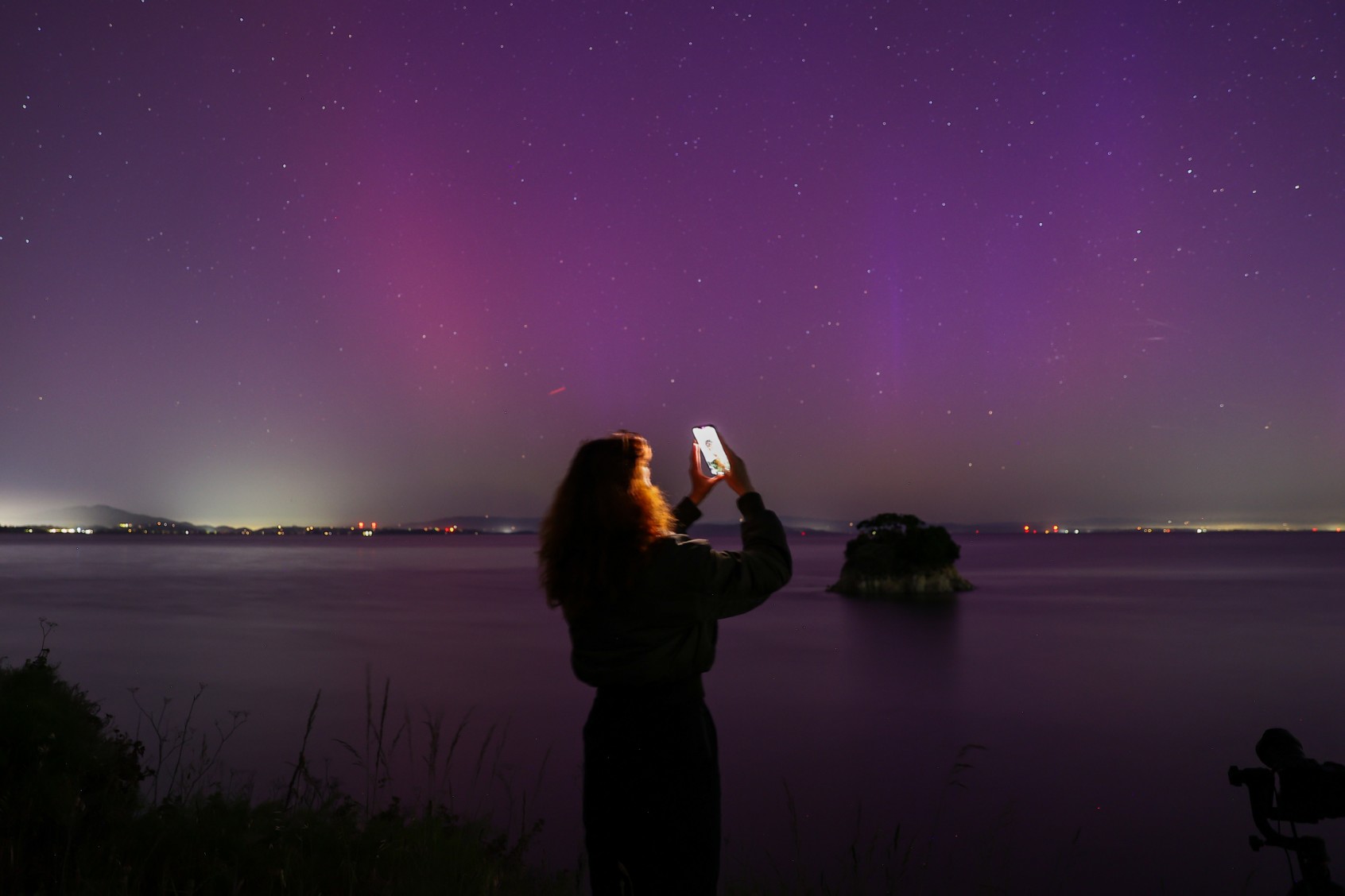 Northern Lights (Aurora Borealis) illuminate the sky of San Francisco North Bay as seen from China Camp Beach in San Rafael, California, United States on May 11, 2024. (Tayfun Coskun/Anadolu via Getty Images)