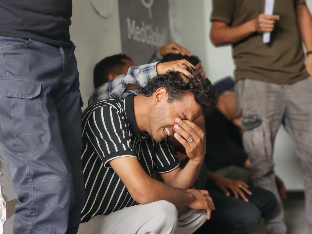 Relatives of Palestinians killed in Israeli attacks on Rafah mourn as the bodies are brought to Tel al-Sultan health centre in Rafah, May 27, 2024. (Hani Alshaer/Anadolu via Getty Images)